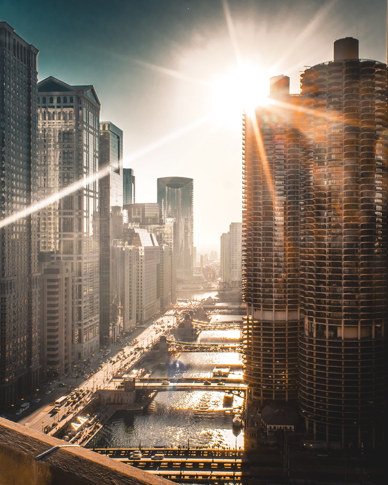 lens flare, residential district, cityscape, city, urban, office building, sunbeam, built structure, financial district, sunlight, neighborhood, skyscraper