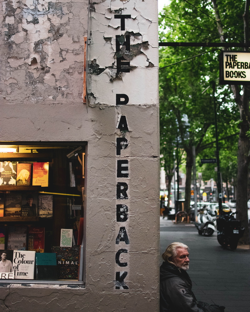 wall, indoors, wooden, architecture, real people, senior adult, built structure, shop, transportation, book, vehicle, sign, adult, white, metropolis, decor