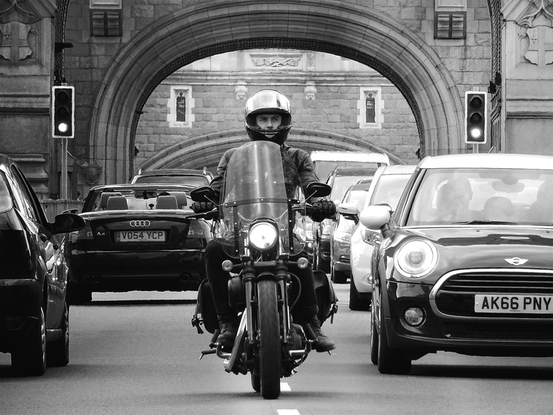traffic, day, security, automobile, land vehicle, person, motion, transportation, motorcycle, bike, travel, photograhy, black-and-white, man, built structure