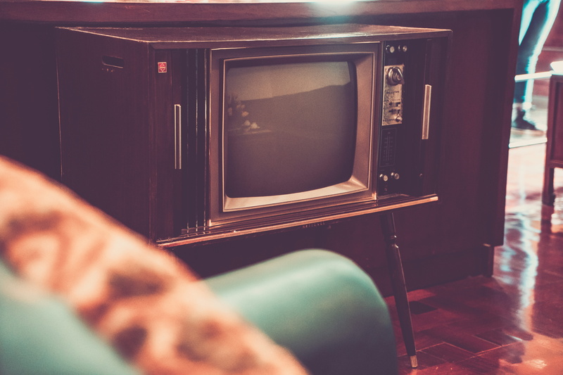 retro, arts culture and entertainment, two people, technology, television, home interior, hand, video, television set, real people, machinery, human hand