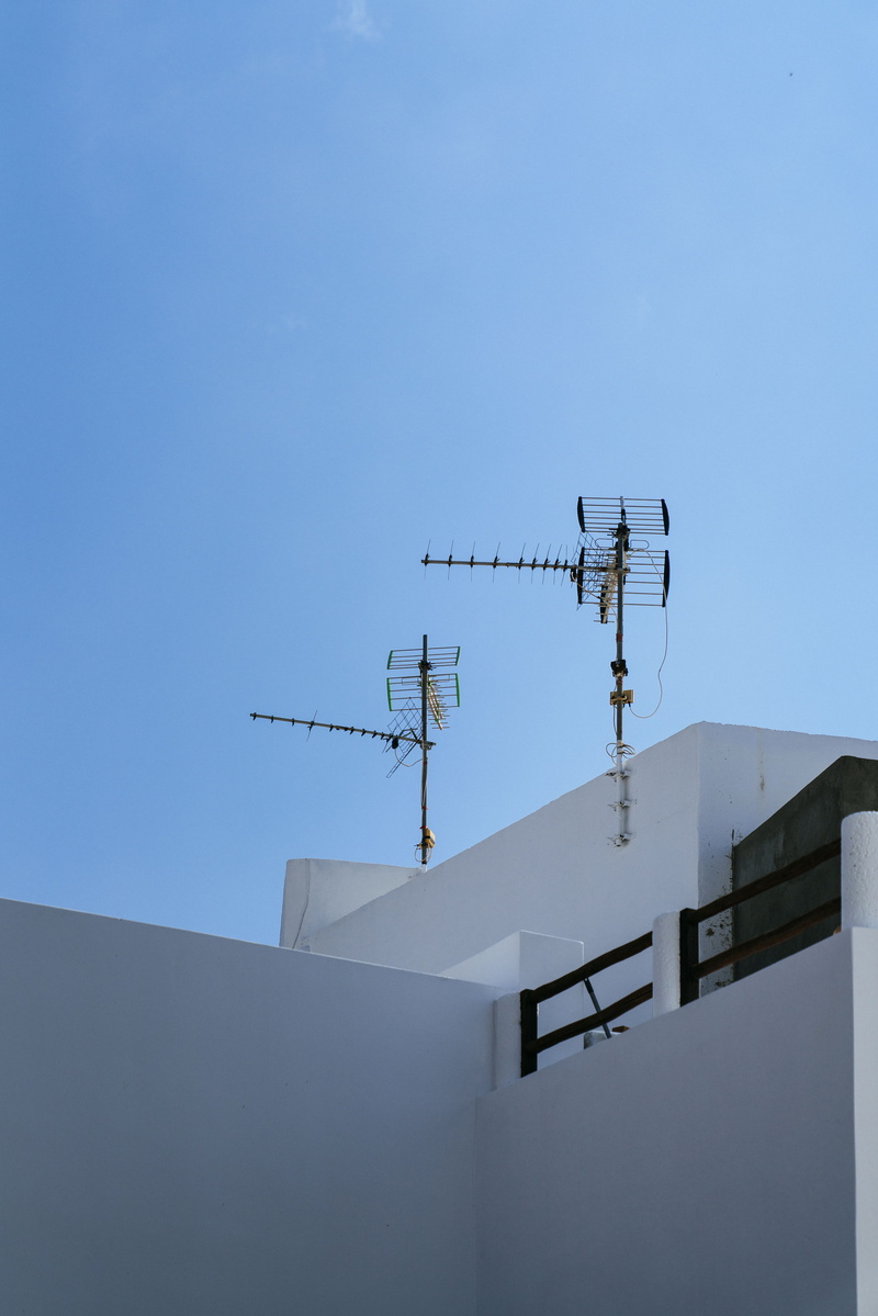 tubing, sunlight, appliance, satellite, brown, condo, wireless technology, no people, global communications, architecture, built structure, building exterior