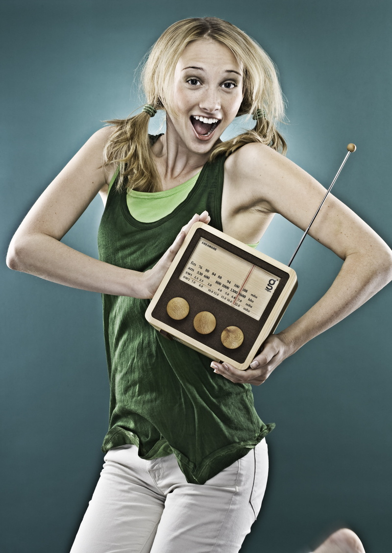 leisure activities, adult, radio, girl, emotion, studio shot, indoors, technology, front view, smiling, woman, hairstyle, brown, people, one person, young adult