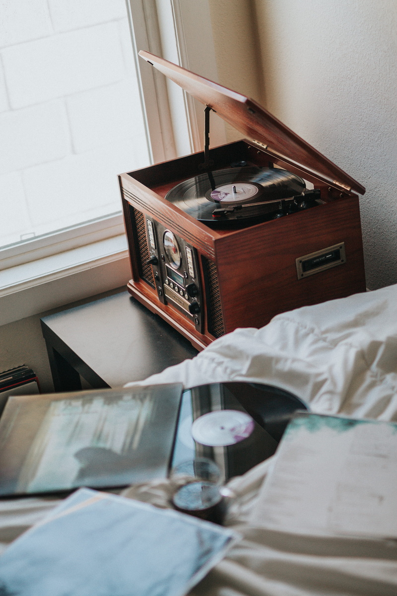 player, luggage, brown, record player, retro styled, wooden, home, book, suitcase, high angle view, no people, window, black, day, indoors, furniture, radiogram