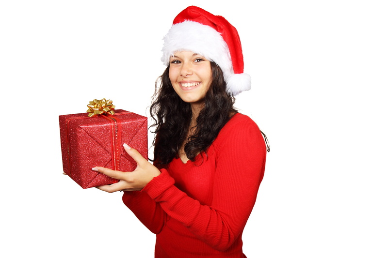 woman, one person, celebration, white, holiday, holding, emotion, smiling, warm clothing, smile, cheerful, holiday - event, happiness, females, santa, young