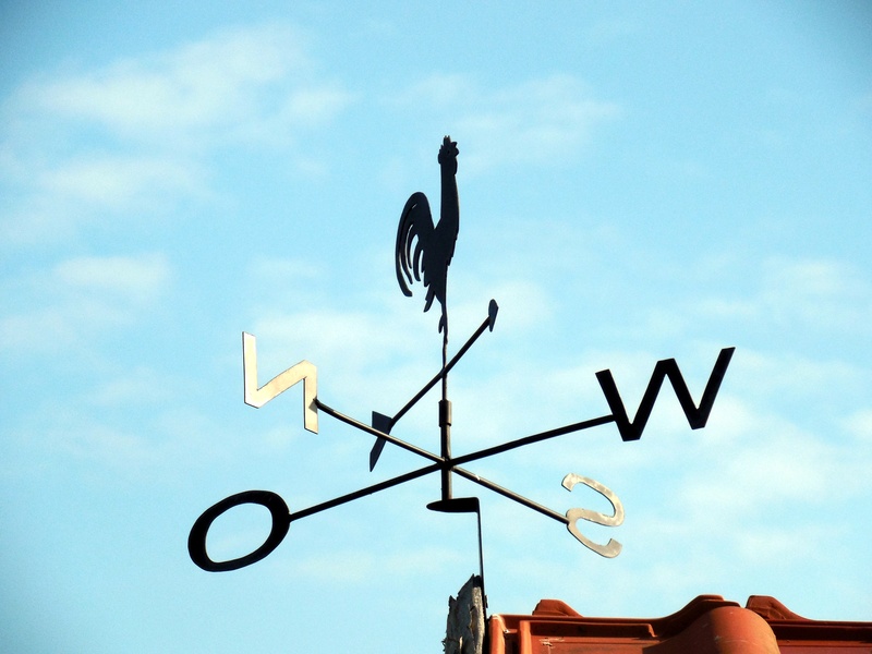 north, guidance, compass point, south, outdoors, vane, communication, directional sign, text, capital letter, wind direction, daytime, cloud - sky, sign