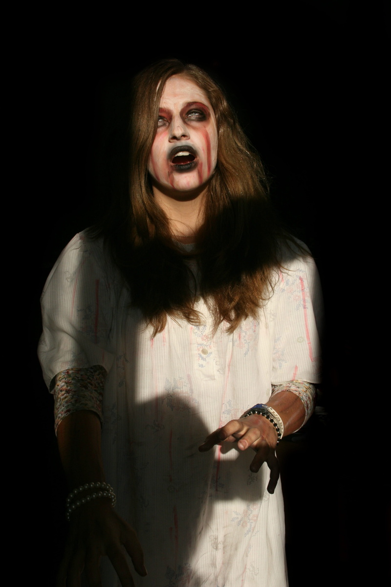 tattoo, 4K, bizarre, emotion, waist up, hairstyle, prosthetics, horror, evil, adult, halloween, looking at camera, studio shot, black background, spooky