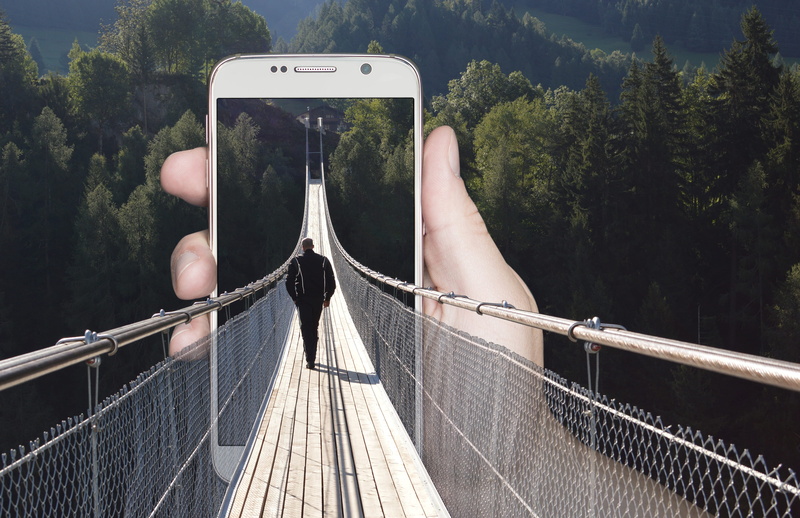 outdoors, bridge, technology, lifestyles, photographing, plant, smart phone, out of the frame, footbridge, communication, suspension, wireless technology