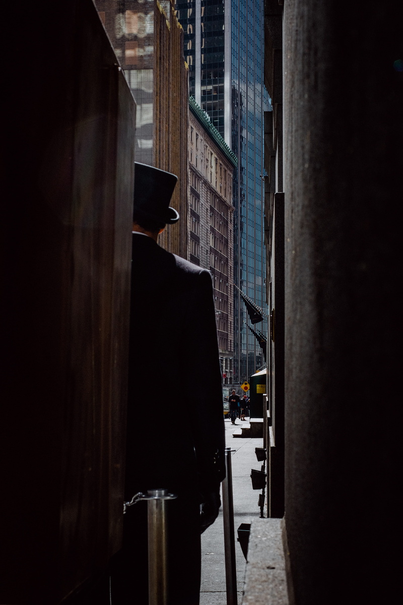 building, doorman, winter, day, alley, urban, nature, street, top, man, city life, mode of transportation, road, standing, architecture, near, office building exterior