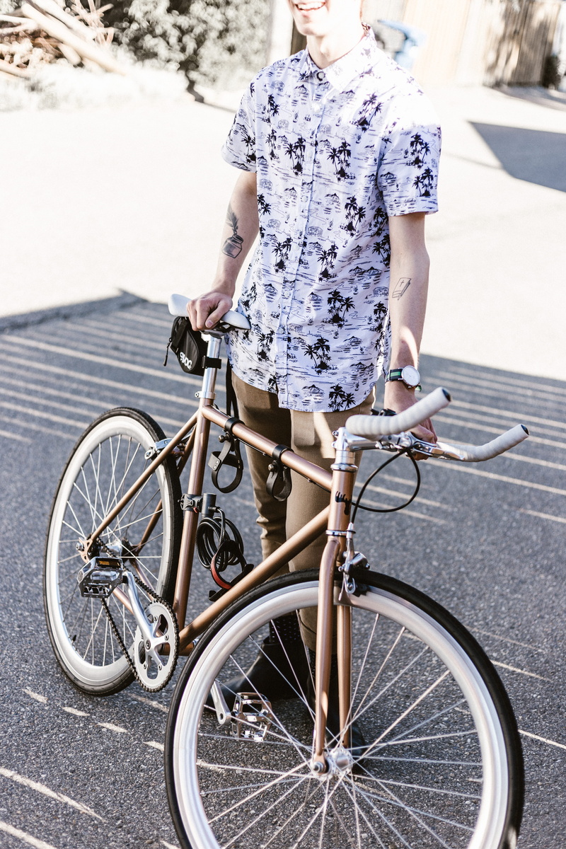 one person, biking, street, sustainable lifestyle, road, black, casual clothing, transportation, youth, mode of transportation, back alley, man, riding