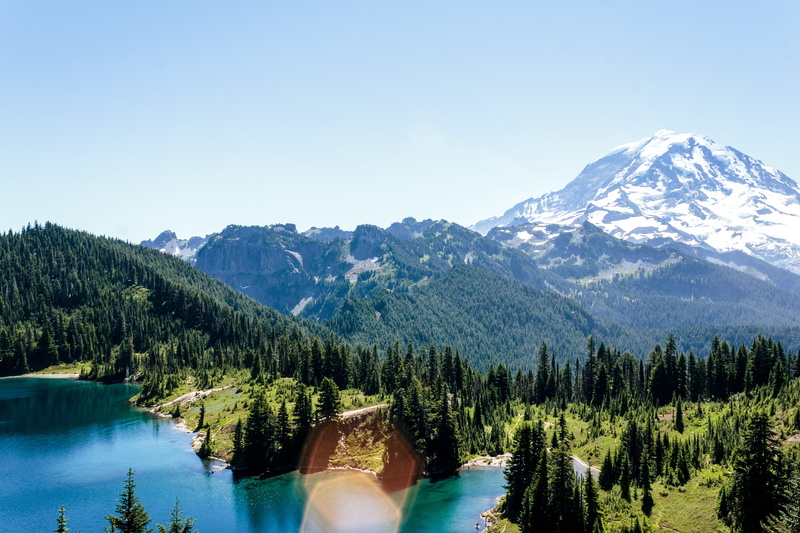 snowcapped mountain, sky, pine tree, trees, mountain, lens flare, hiking, outside, 5K, beauty in nature, clear sky, mountaineer, nature, aerial, camping
