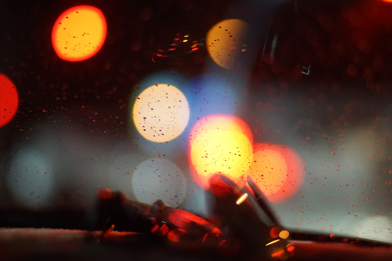 lighting equipment, glass - material, windshield, car, vehicle interior, rainy season, indoors, illuminated, night, lens flare, wet, light, 5K, multi colored