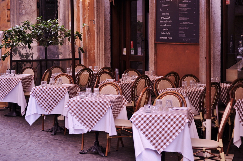 building, business, europe, front, glass, pizza, order, bistro, furniture, table, patio, outside, no people, table cloth, french, setting, glasses, architecture