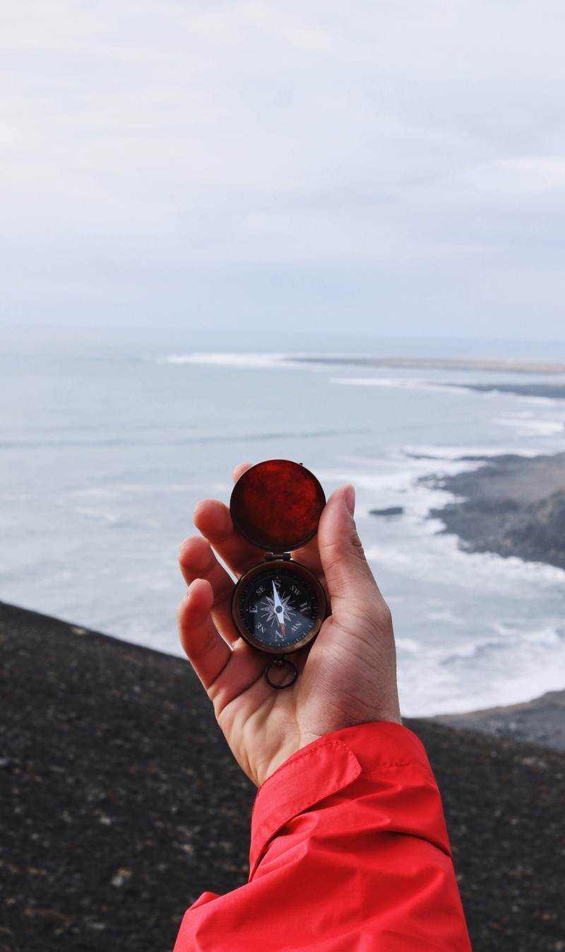beauty in nature, red, nature, ocean, sky, navigate, heading south, beach, focus on foreground, navigation, fruit, people, outdoors, pointing, real people