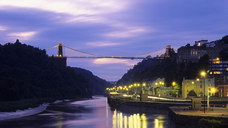 building exterior, cityscape, no people, bay, 720P, outdoors, reflection, clifton suspension bridge, travel destinations, city, water, dusk, bridge, bridge - man made structure