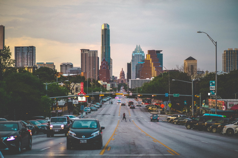 mode of transportation, no people, skyline, car, office building exterior, city street, architecture, outdoors, street, sky, austin, financial district