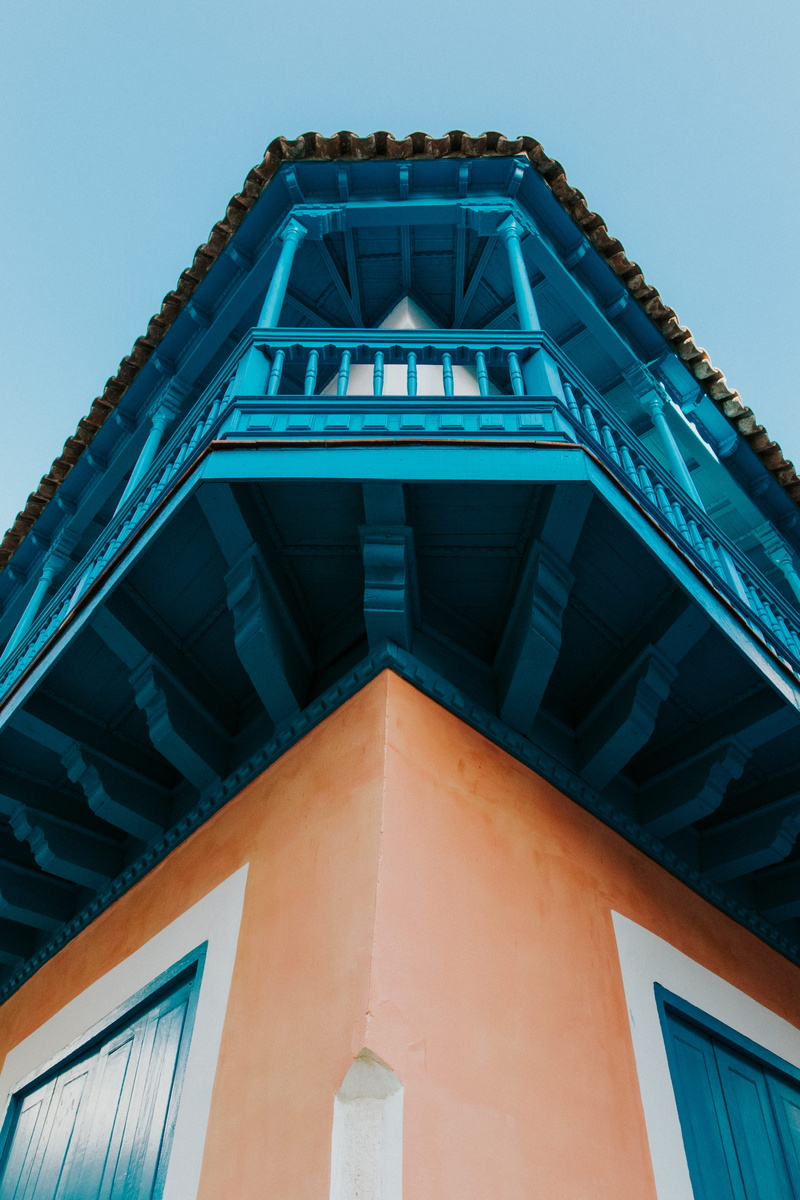 sunlight, brown, house, two, blue, building, low angle view, nature, 5K, day, outdoors, orange, painted, view, travel, architecture, tourism, city, built structure
