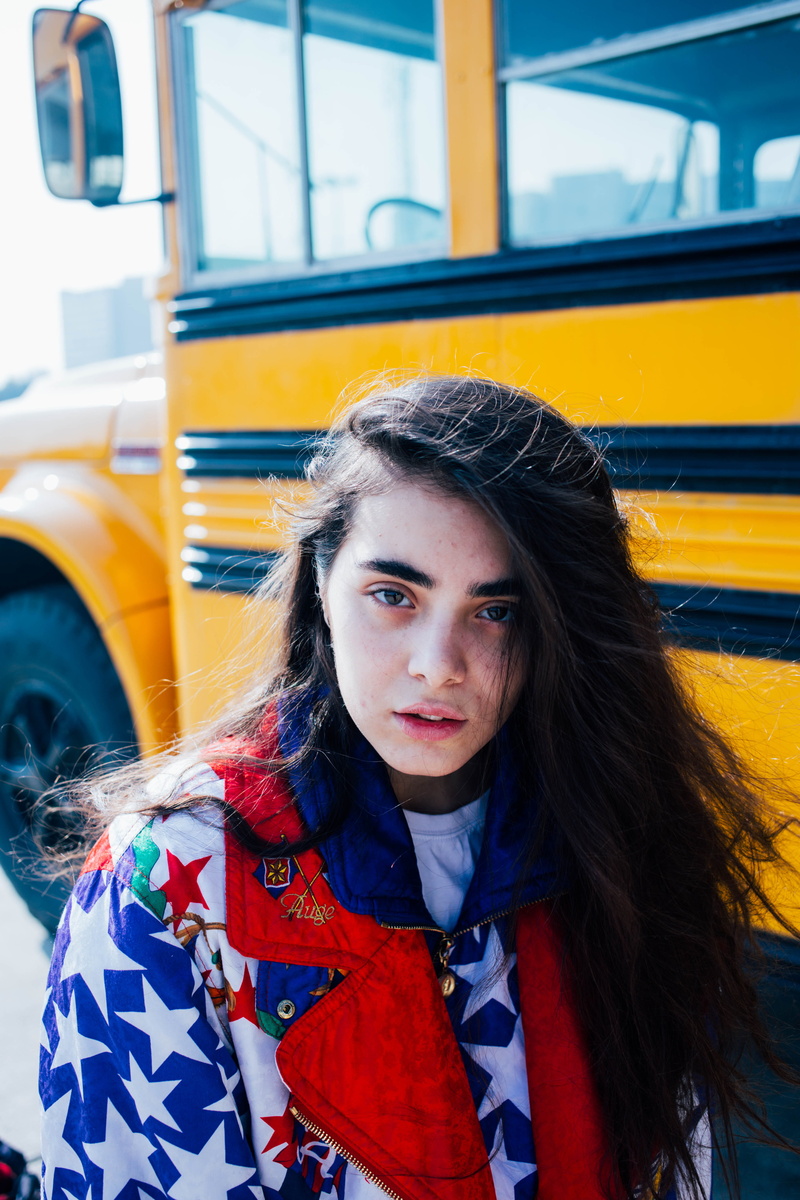 warm clothing, female, outdoors, long hair, real people, car, person, lifestyles, young adult, leisure activity, white, scarf, motor vehicle, clothing