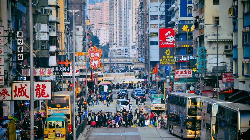 downtown, street, outdoors, motor vehicle, land vehicle, city street, double decker bus, real people, car, built structure, advertisement, transportation