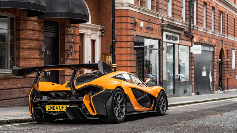 mclaren, transportation, garage, day, yellow car, road, built structure, mode of transportation, photography, taxi, sports car, land vehicle, brick wall