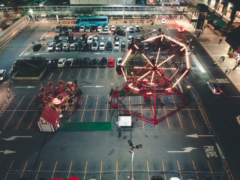 illuminated, architecture, av. das nações unidas, city street, high angle view, street, sign, photography, vehicle, urban, real people, parking lot, men