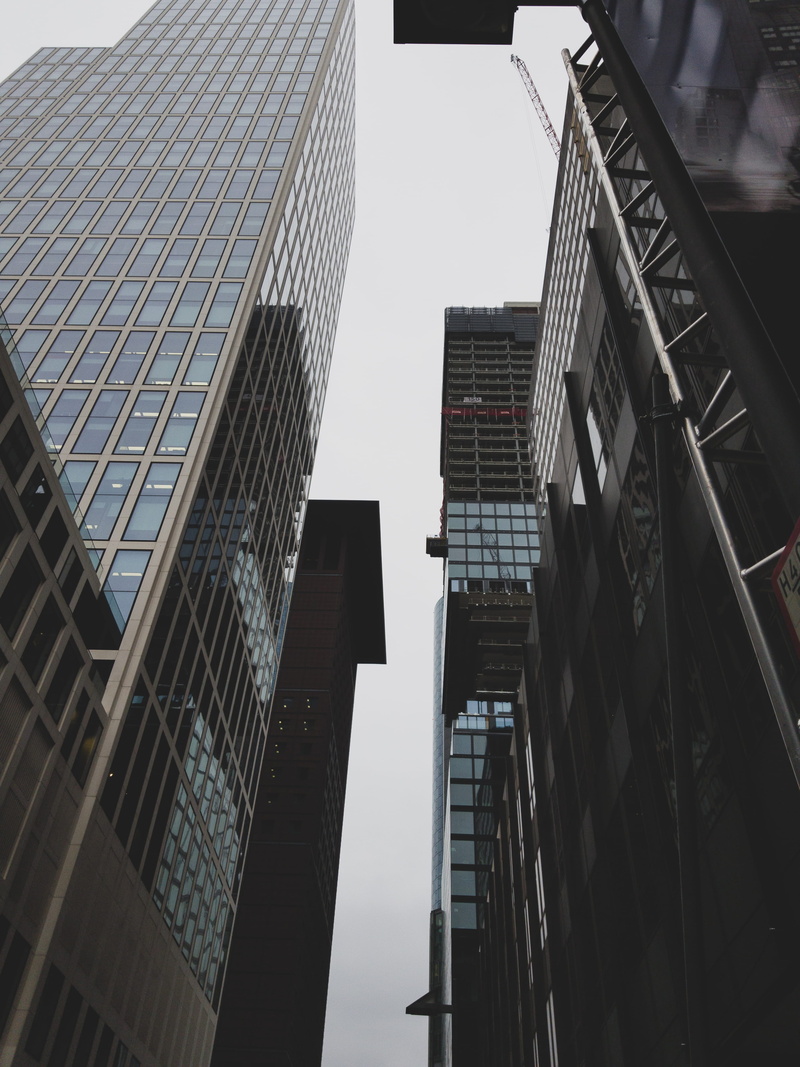 no people, business, tower, apartment building, city, outdoors, high rise, town, coupe, glass - material, architecture, skyscraper, housing, vehicle, downtown