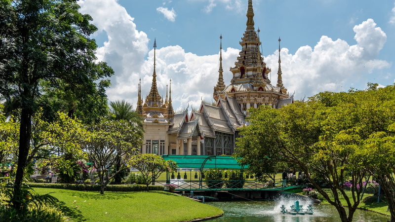 water, place of worship, building, architecture, growth, cloud - sky, spirituality, grass, tower, mahawiharn temple, built structure, nakhon ratchasima