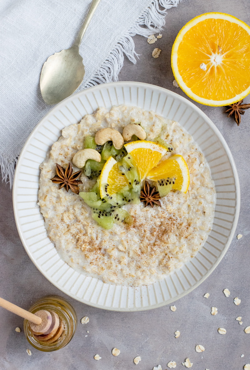 ready-to-eat, citrus fruit, kiwi, food and drink, bowl, porridge, oats, table, breakfasy, garnish, sliced, star anise, breakfast, still life, ceramic, eating utensil