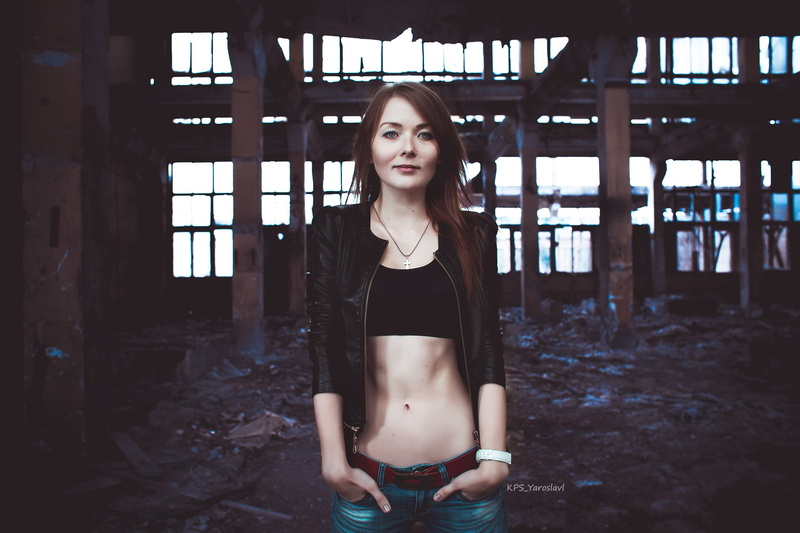 model, jacket, short tops, leather jackets, black tops, necklace, black jackets, jeans, belly, depth of field, abandoned, brunette, smiling, looking at viewer