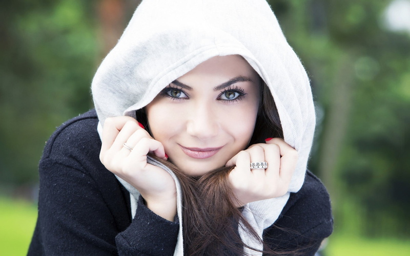 hood - clothing, black, portrait, human face, hand, looking at camera, happiness, young women, women, clothing, adult, one person, beautiful woman, headshot