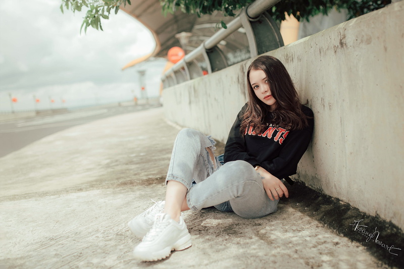 women, torn jeans, women outdoors, looking at camera, legs crossed, casual clothing, hairstyle, beautiful woman, one person, leisure activity, lifestyles