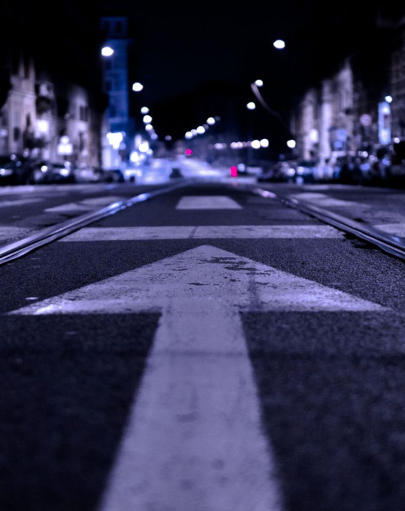 road marking, symbol, surface level, urban city, eye, city, forward, worm, street, city street, architecture, built structure, purple, dividing line, rail