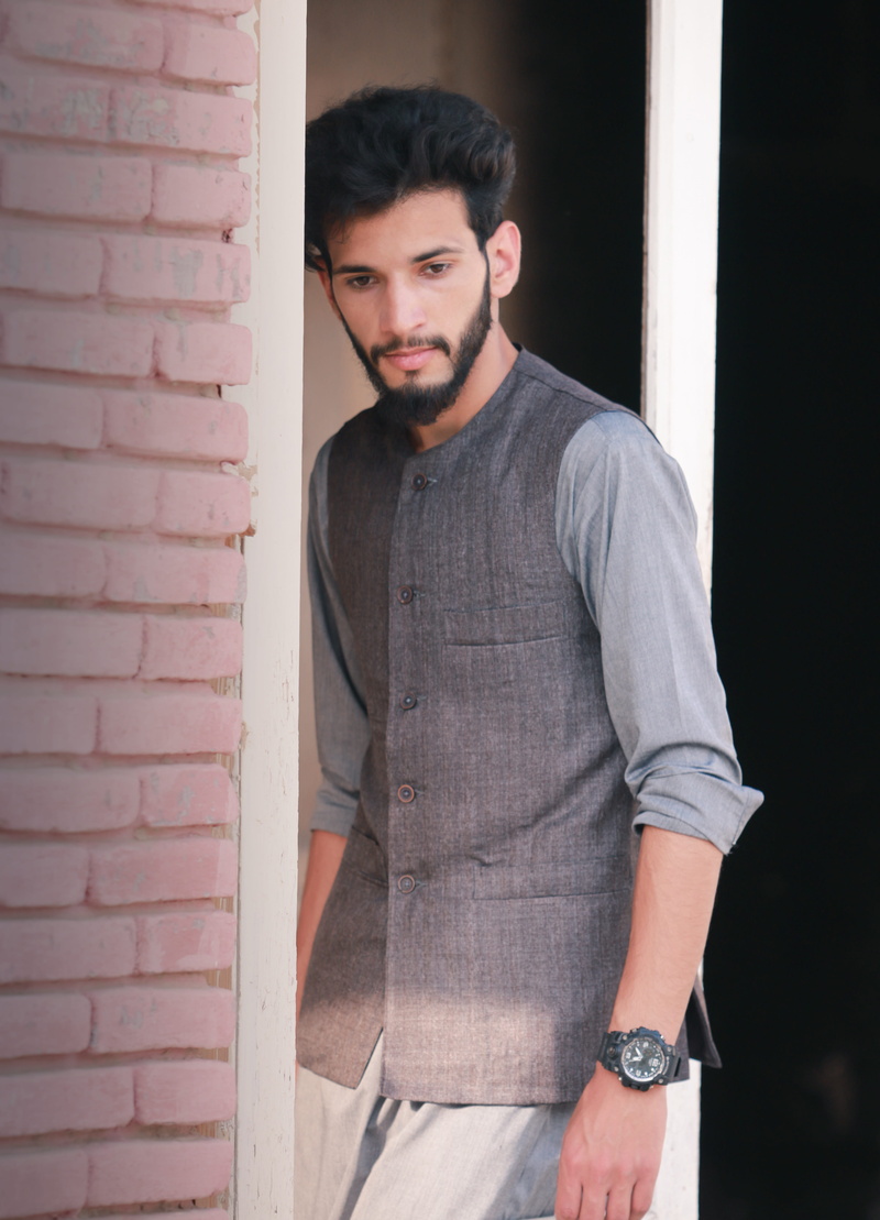 looking at camera, real people, glasses, entrance, wall - building feature, stylish boy, young adult, nature, asian boys, one person, model, pakistan, brick wall
