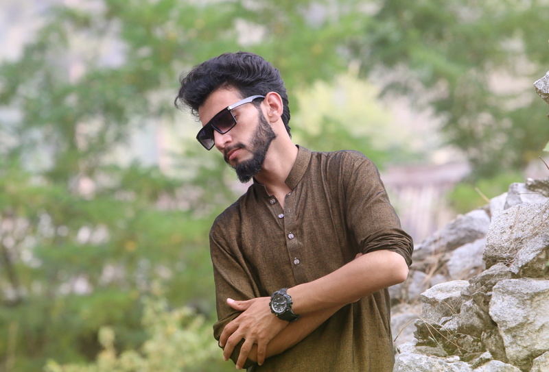 time, waist up, posing, mans fashion, focus on foreground, young men, blurry background, lifestyle, real people, lifestyles, portrait, one person, casual clothing