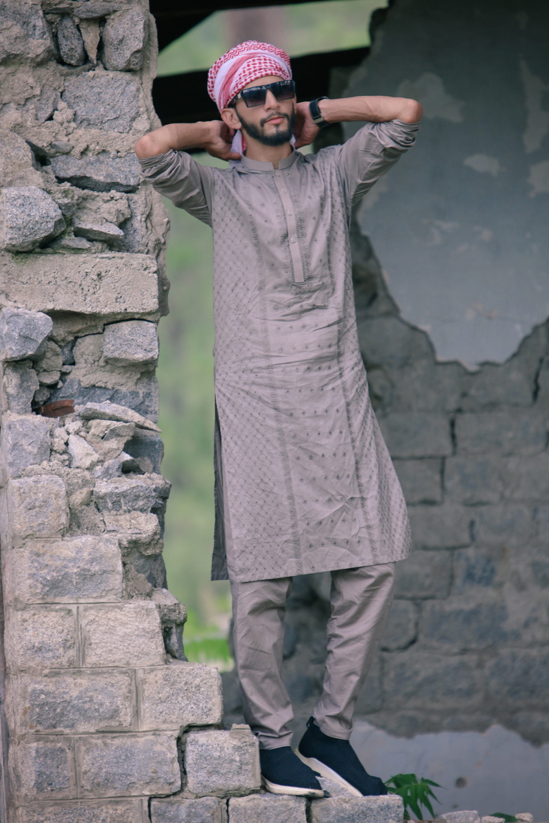 childhood, tree, fashion, full length, pakistan culture, wall - building feature, kurta design, innocence, kurta, style, yellow, real people, asia, boys style