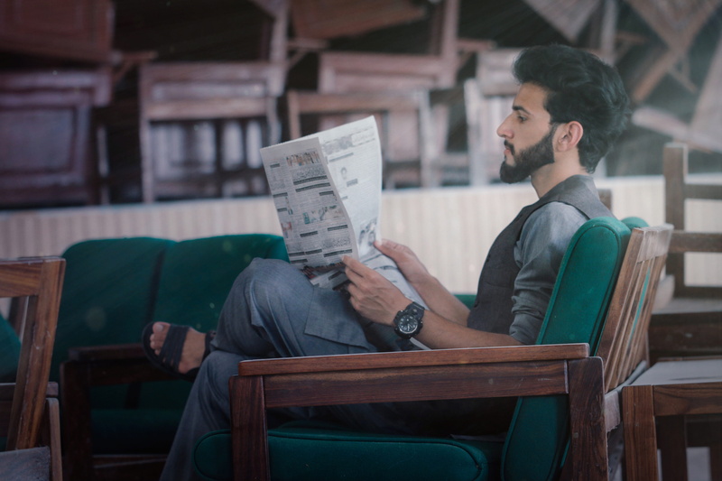 reading, pakistan, asian boys, holding, glasses, three quarter length, model, posing, chair, young, seat, activity, 5K, real people, one person, men, man