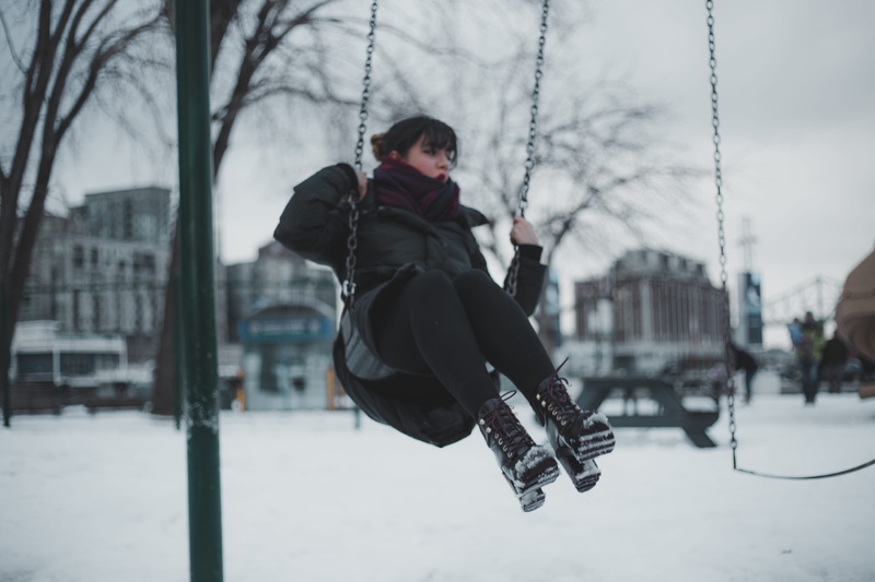 amusement park, outdoors, gril, kids playground, park, scarf, dark, women, day, focus on foreground, leather, one person, leisure activity, timberland
