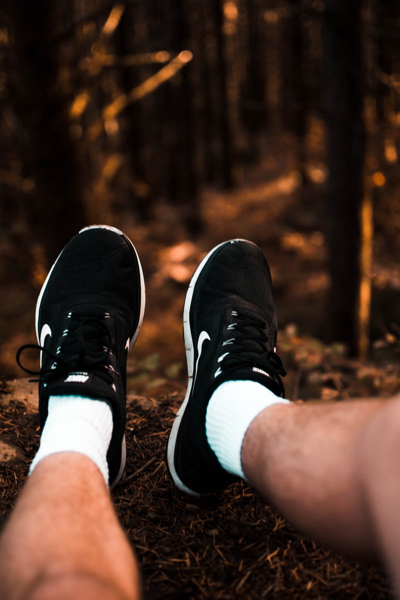 leisure activity, limb, day, hamilton mountain trail, orange, tree, legs, feet hanging off edge, land, forest, outdoors, men, shoe, selective focus, real people