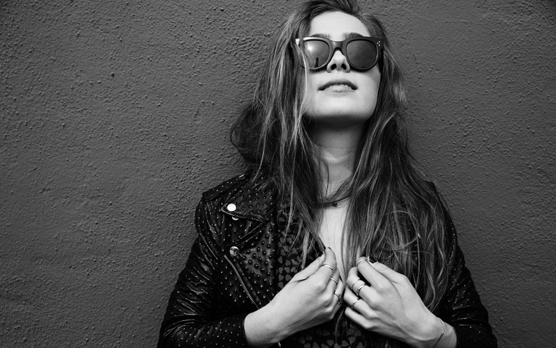 front view, beautiful woman, wall - building feature, real people, hairstyle, lifestyles, long hair, beauty, adult, monochrome, women, Haley Lu Richardson