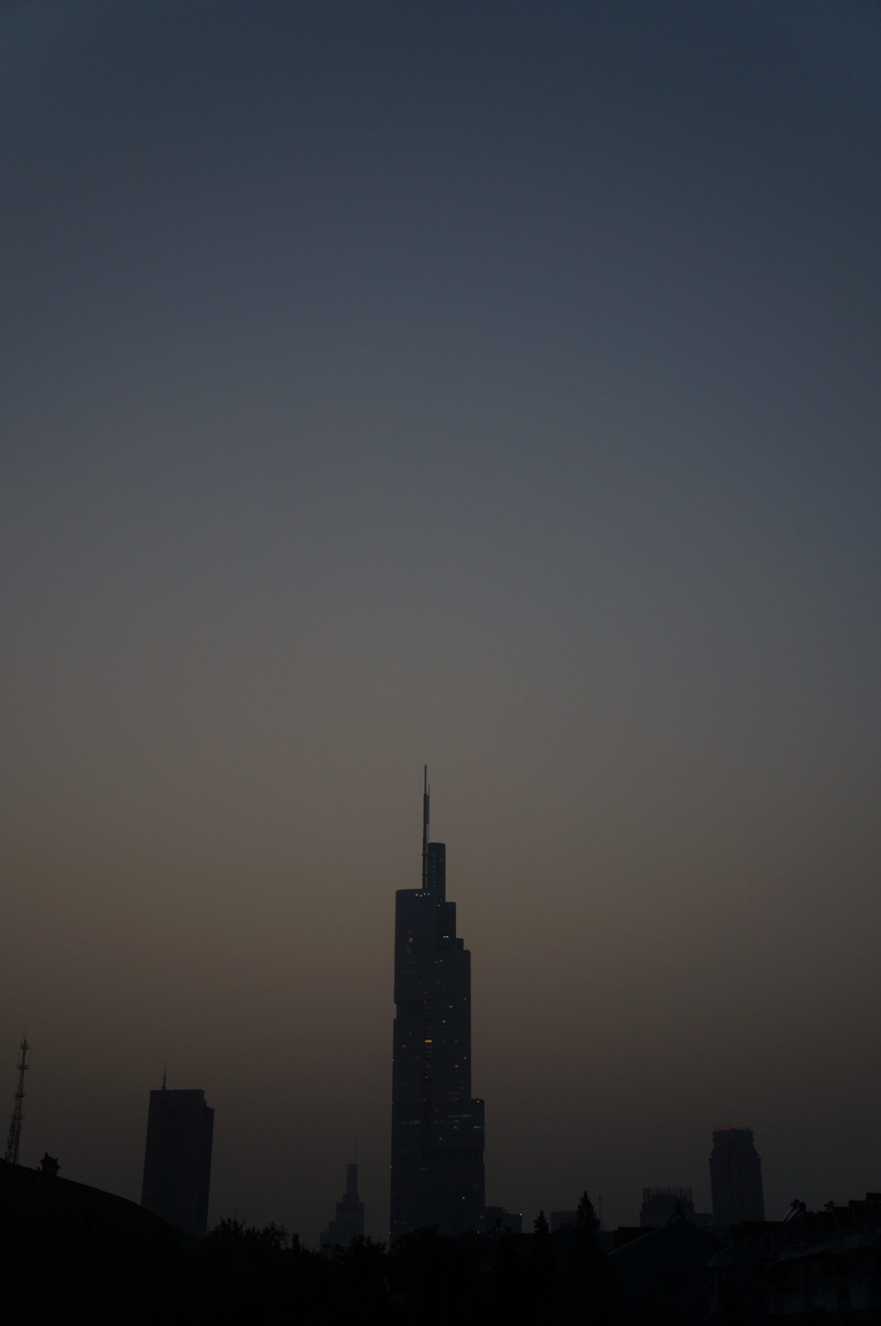 cityscape, silhouette, sky, sunset, outdoors, urban Skyline, no people, skyscraper, architecture, spire, building Exterior, financial district, Tall Buildings