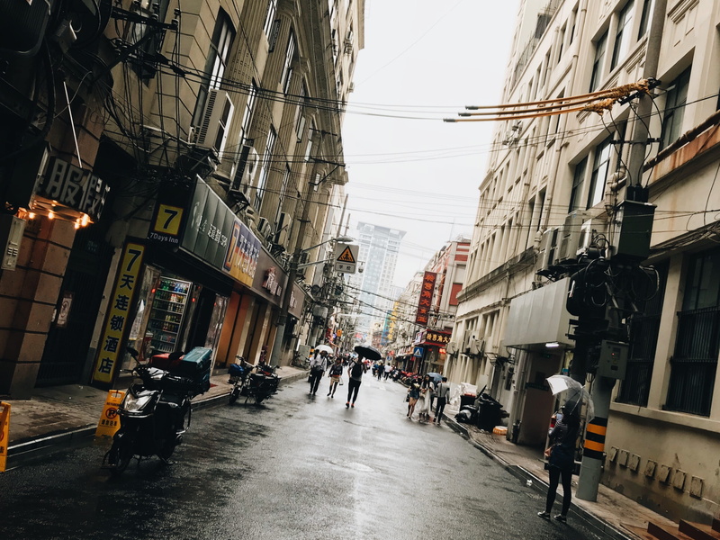 city life, city, transportation, road, group of people, nanjing road, land vehicle, real people, rain, the way forward, men, outdoors, china, built structure