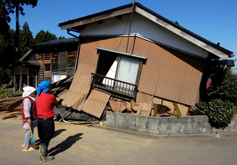 lifestyles, Japan, leisure activity, building, nature, men, hat, full length, sunlight, rear view, real people, architecture, earthquakes, clothing, building exterior