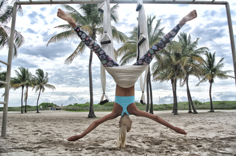 day, woman, gravity, one person, cloud - sky, sky, miami, shorts, yoga, outdoors, female, leisure activity, upside down, growth, young adult, aerial yoga
