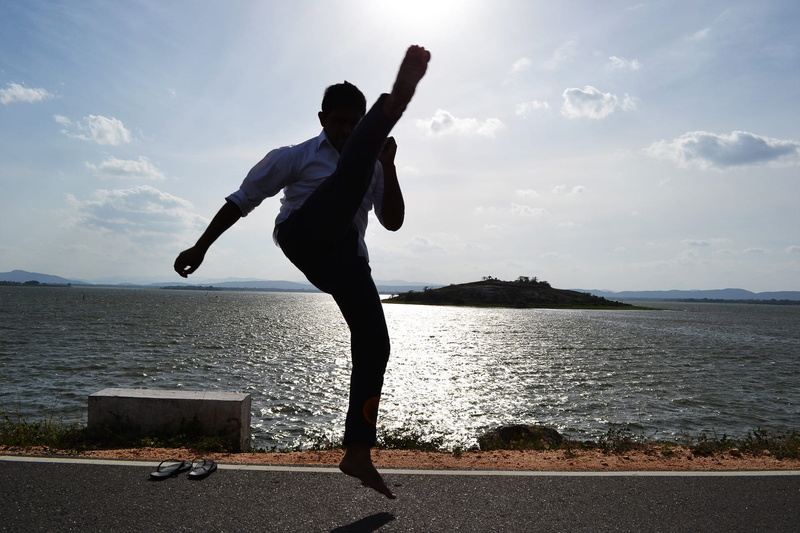 sri lanka, fighter, sport, road, kung fu, sky, cloud - sky, boy, warrior, standing, real people, beauty in nature, mawanella, leisure activity, rear view