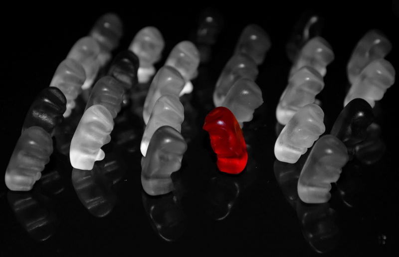 still life, indoors, human hand, maverick, alone, close-up, selective, fruit jelly, black background, large group of objects, isolated, photography, crystal