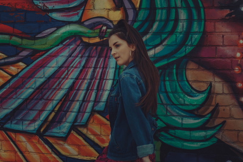 looking, young girl, the baltic triangle, contemplation, 5K, beautiful woman, multi colored, stained glass, standing, one person, art, jacket, denim, teenager