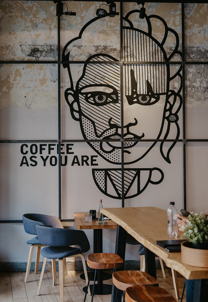 table, chair, woman, text, home interior, day, 2K, wall - building feature, plywood, cafe, banister, art, nature, handrail, canvas, dining, cafeteria