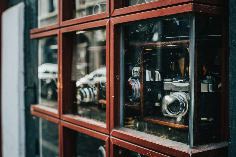 indoors, transportation, displayed, retro, camera - photographic equipment, assorted, shelf, window, photography themes, day, architecture, display, vehicle