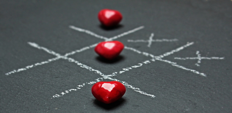 white color, leisure activity, board, toe, positive emotion, selective focus, tac, game, blackboard, relaxation, team sport, indoors, success, object, heart shape