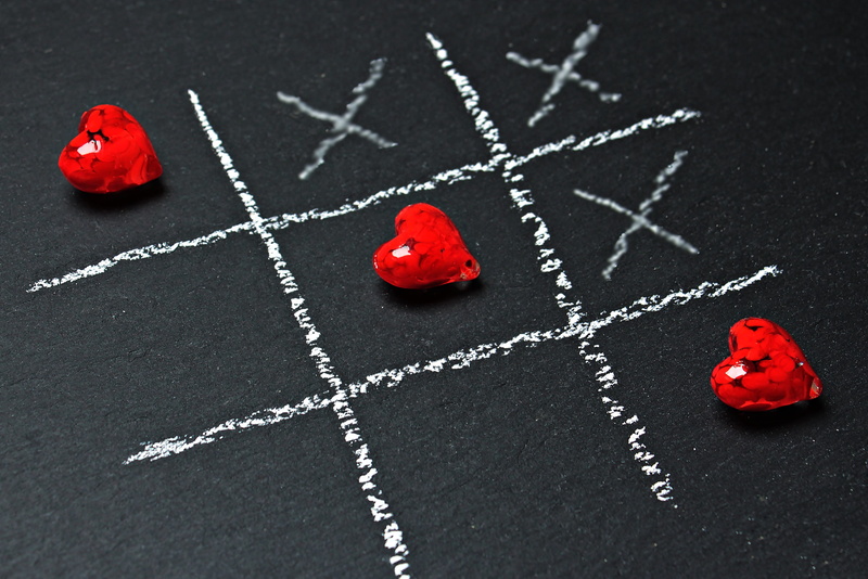 drawing - art product, high angle view, strategy game, leisure games, handmade, heart, symbol, love, strategy, chalkboard, cross, tic tac toe, leisure activity