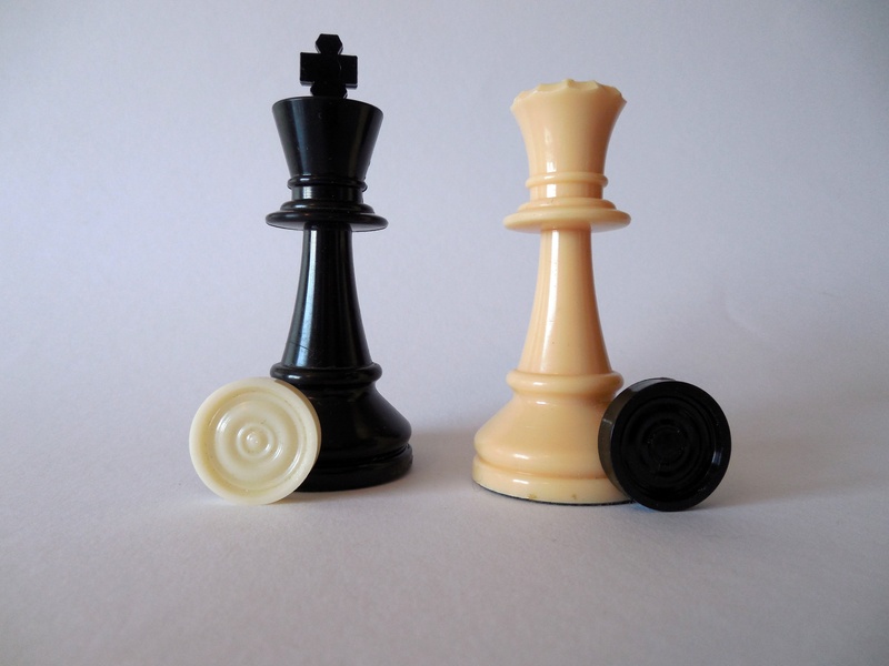 competition, group of objects, game, studio shot, table, strategy, relaxation, no people, figures, white, black, leisure games, lady, white color, two objects